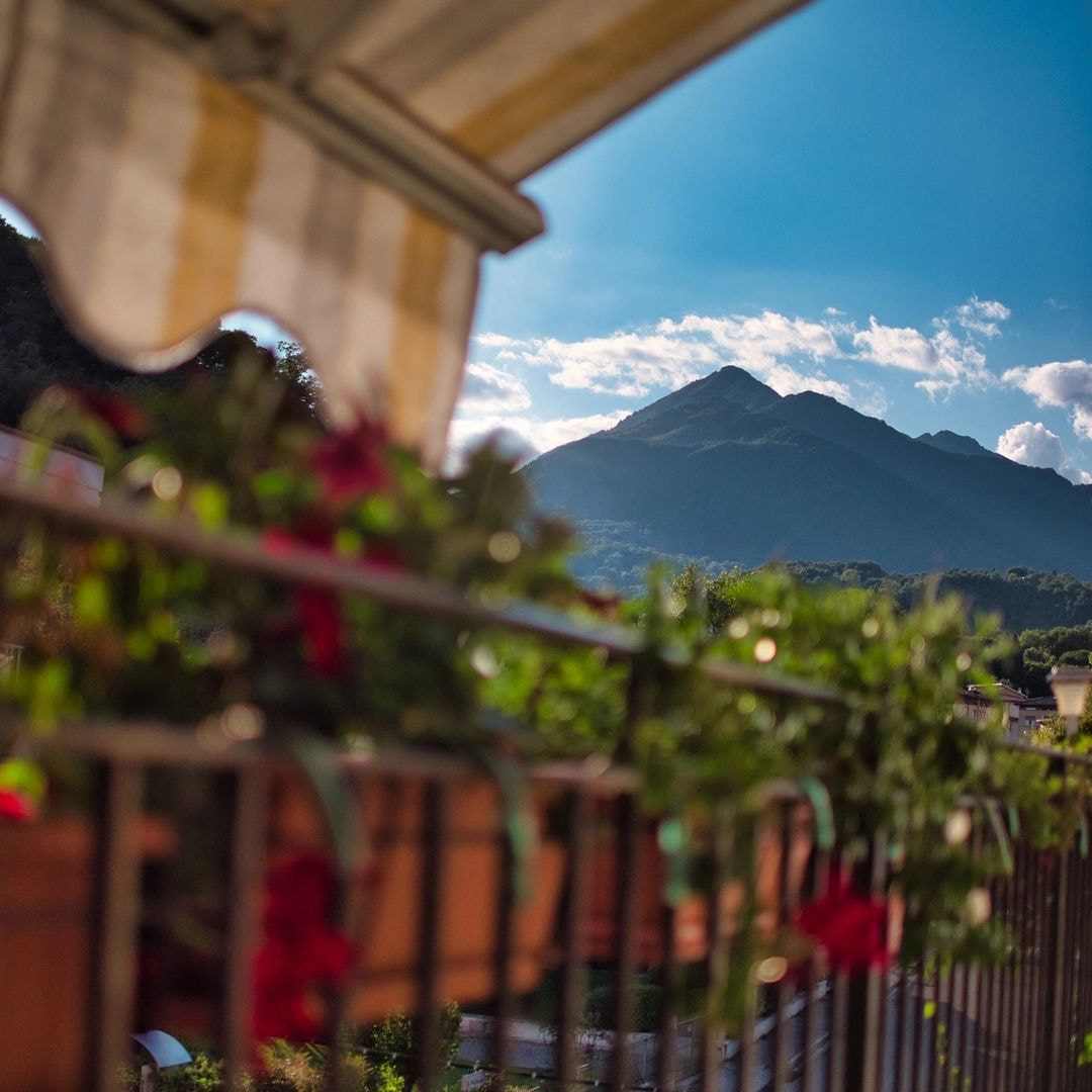 a balcony with a mountain in the background