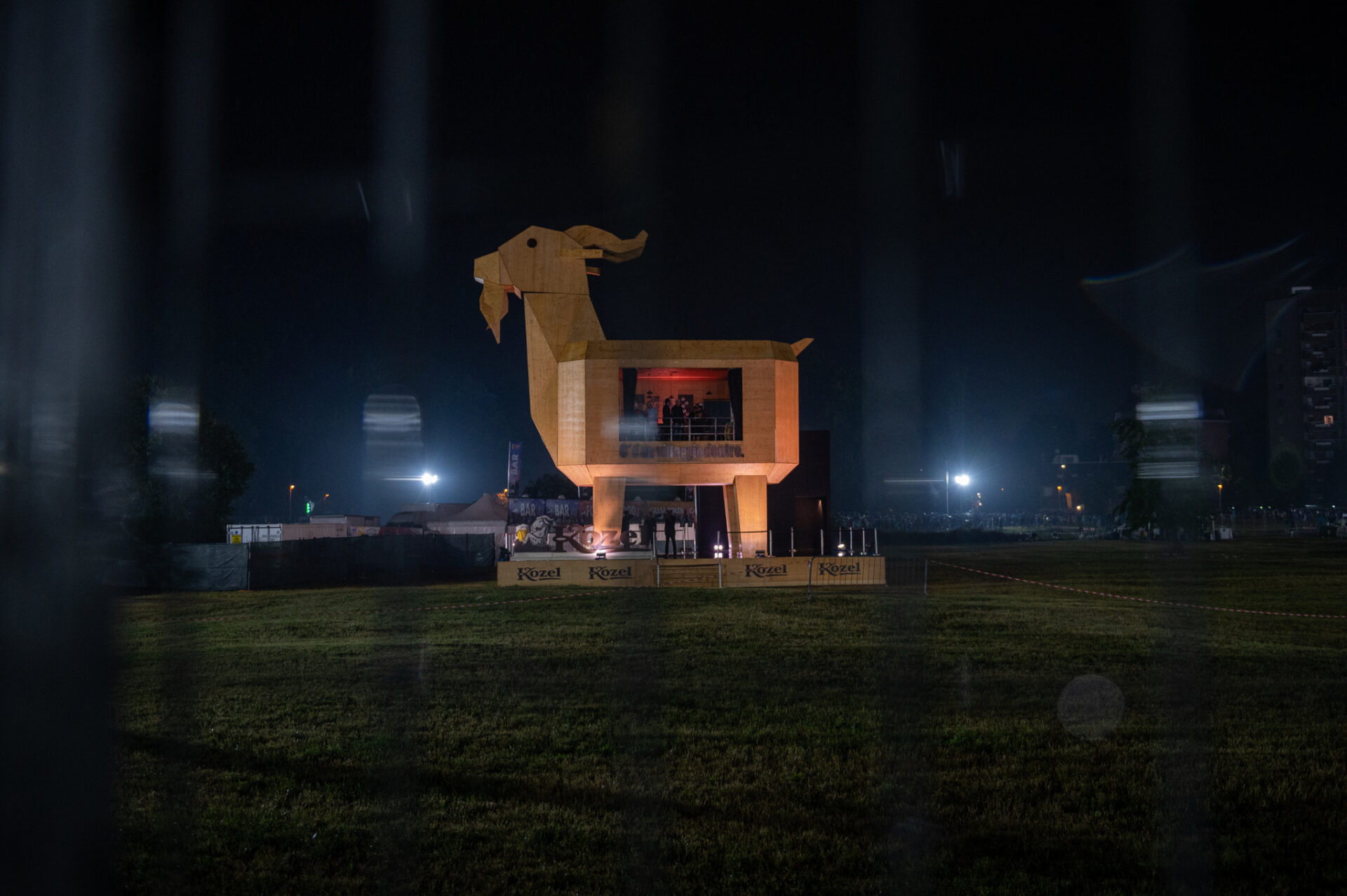 a building with a statue in the middle at night