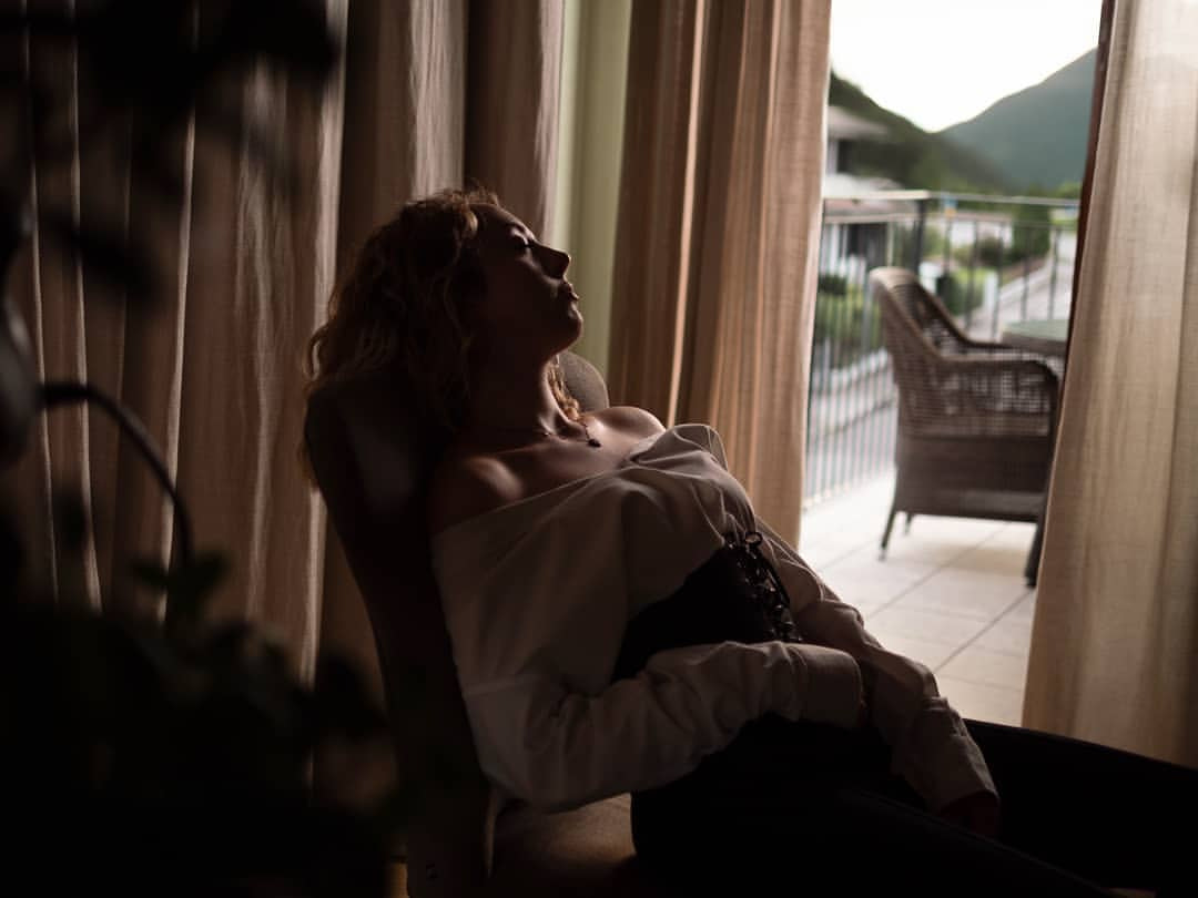 a lady sitting in a chair