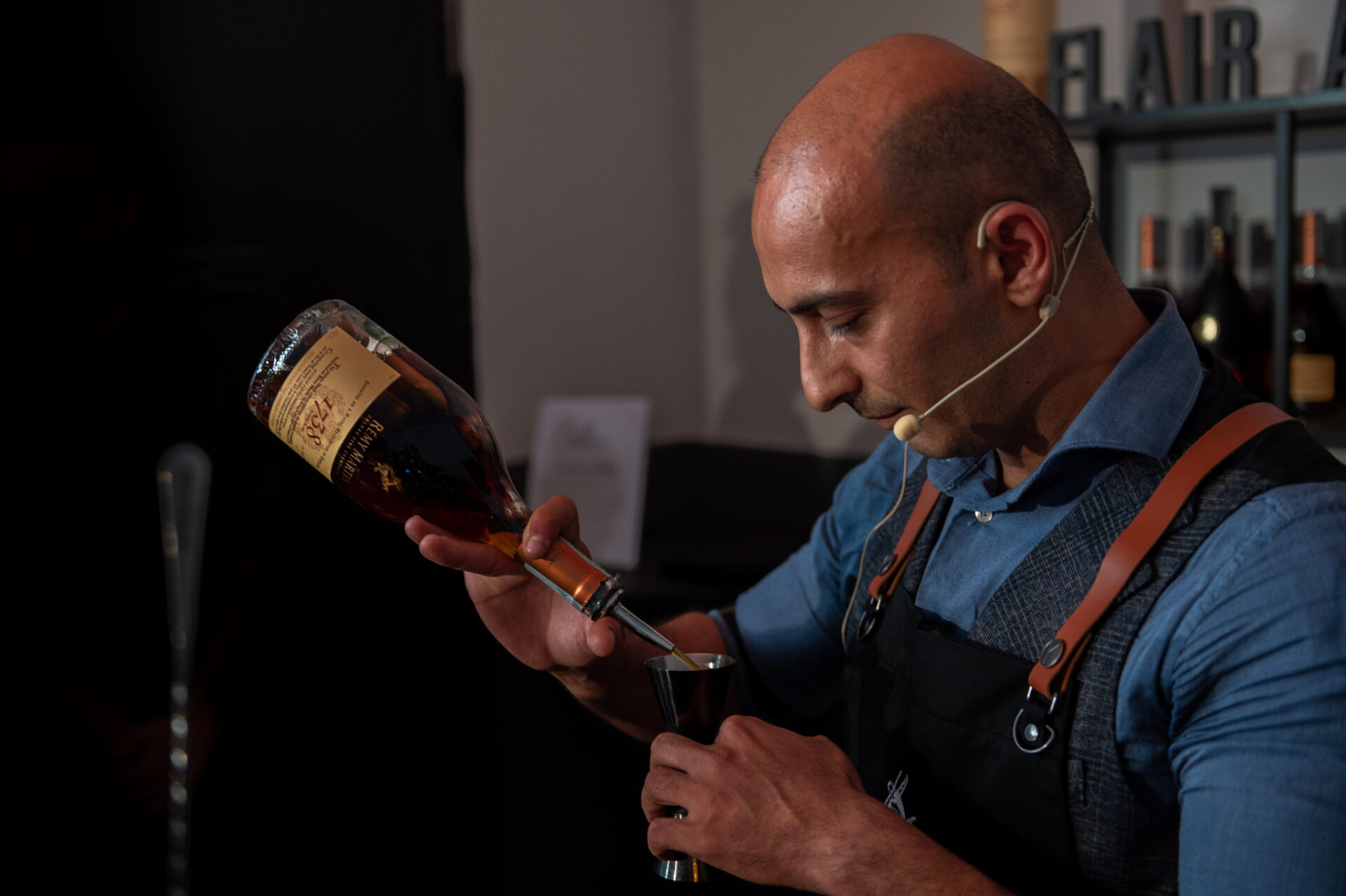 a man drinking a glass of wine