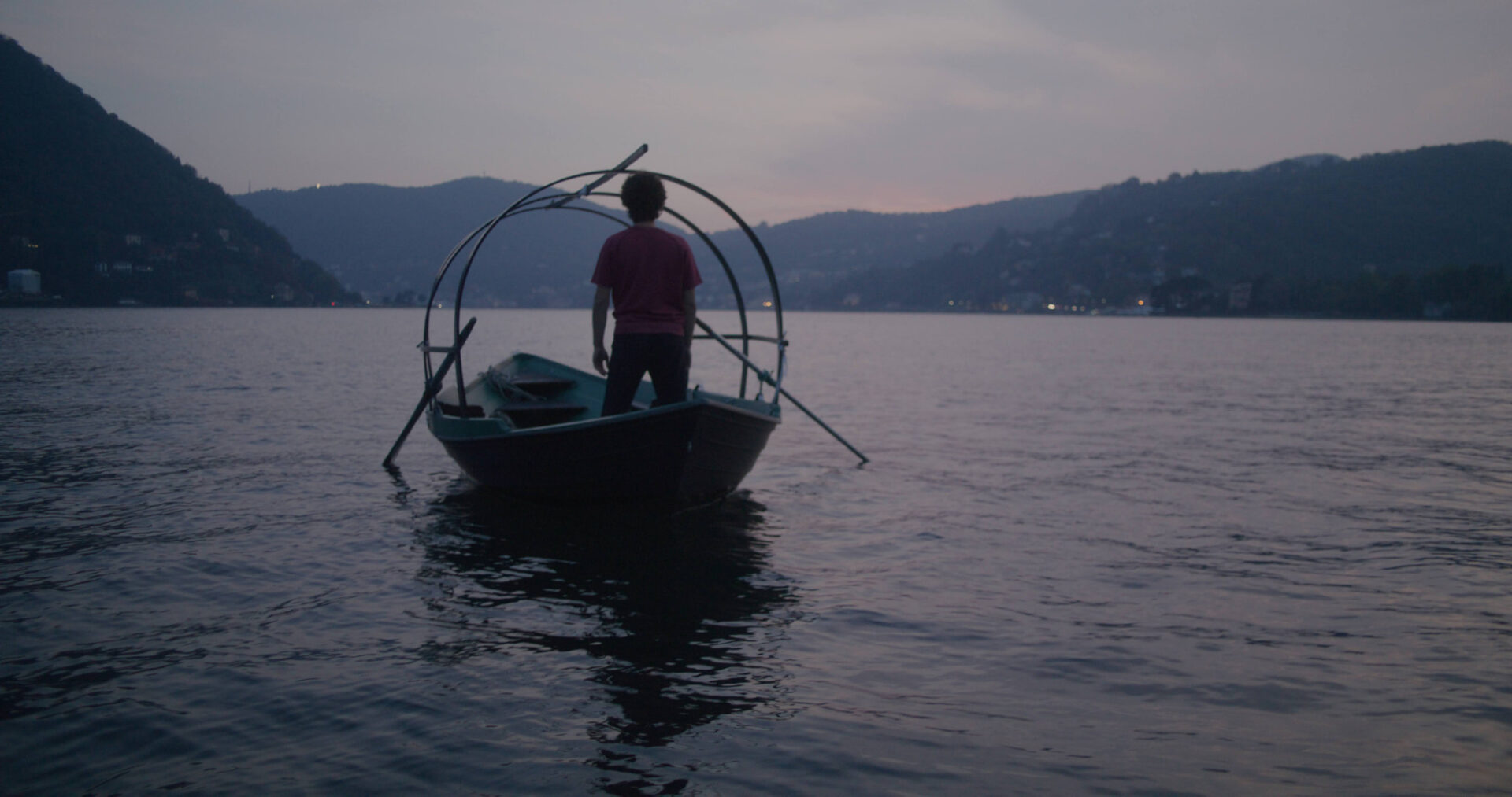 a man in a boat on the water